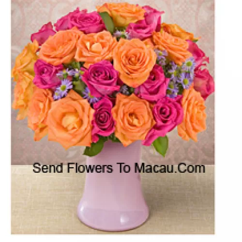 15 Pink And 10 Orange Roses With Seasonal Fillers In A Glass Vase