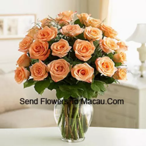 25 Peach Roses With Some Ferns In A Glass Vase