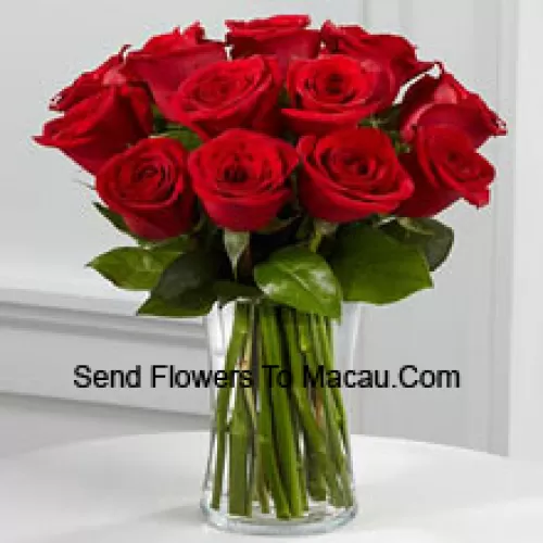 11 Red Roses With Some Ferns In A Vase